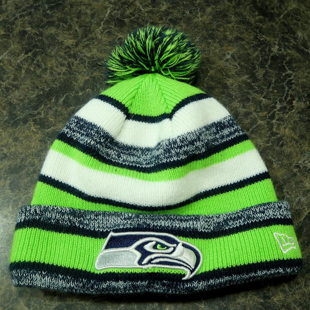 Settle Seahawks Pom green, white and black beanie.